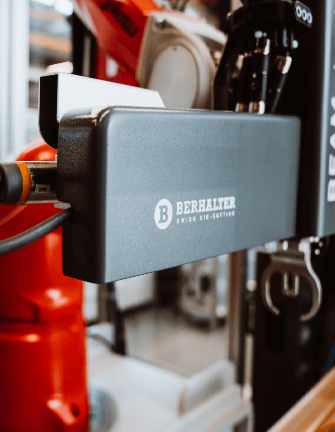 BEAMstack™ robotic system with BERHALTER Swiss Die-Cutting branding, ensuring precision in automated packaging.
