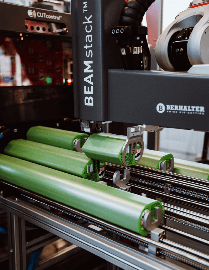 BEAMstack™ robotic gripper system handling die-cut products on a conveyor.