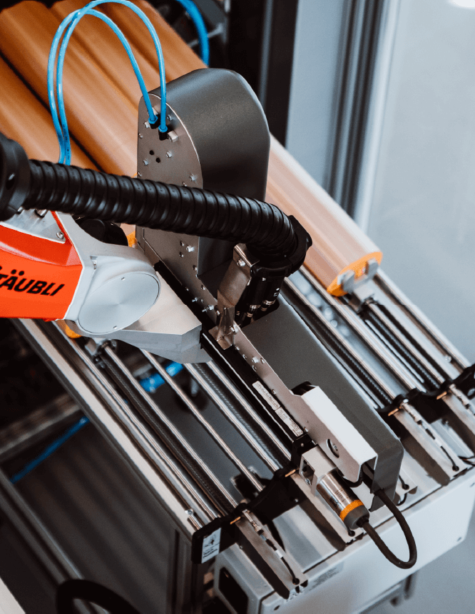BEAMstack™ robotic arm in operation, ensuring precise handling of die-cut stacks.